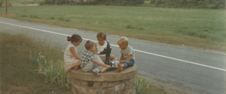 Photograph of children around well